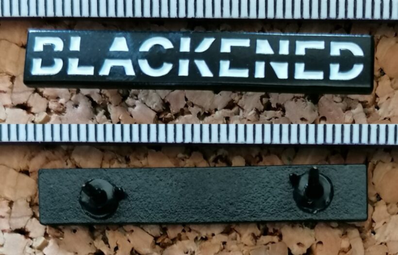 Second picture of X Second picture of Blackened Logo Enamel Pin