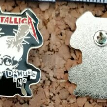 Second picture of X Second picture of Damage Inc. Enamel Pin
