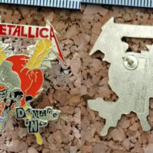 Second picture of X Second picture of Damage Inc. Enamel Pin