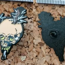 Second picture of Damage Inc. Enamel Pin
