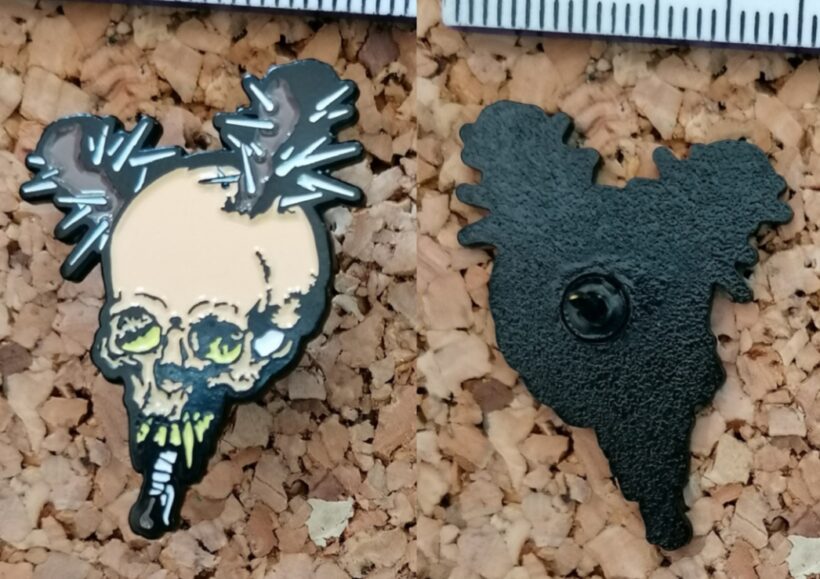 Second picture of Damage Inc. Enamel Pin