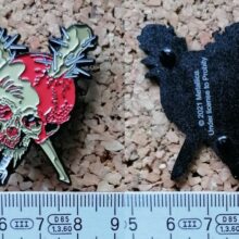 Second picture of X Second picture of Damage Inc. Enamel Pin
