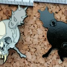 Second picture of X Second picture of Damage Inc. Enamel Pin