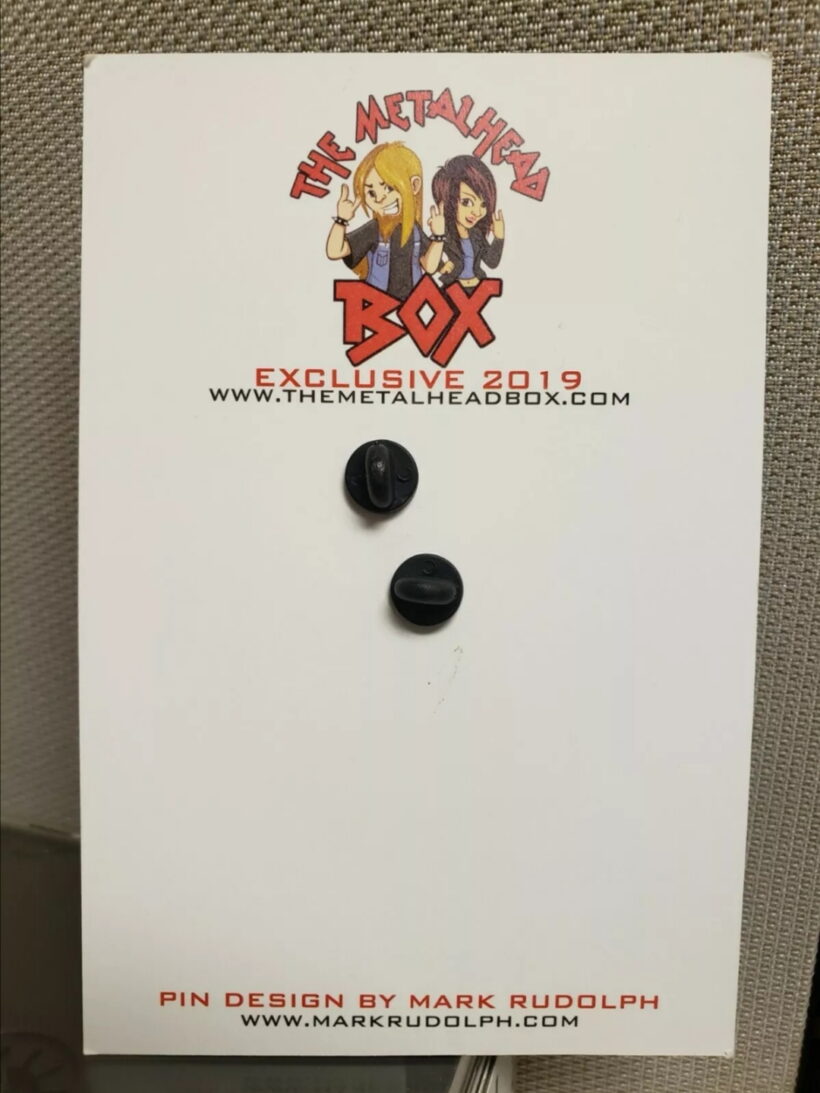 Back of the packaging of Damage Inc. Enamel Pin Back of the packaging of Damage Inc. Enamel Pin