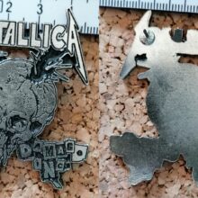 Second picture of X Second picture of Damage Inc. Enamel Pin