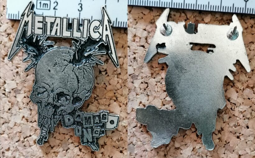 Second picture of X Second picture of Damage Inc. Enamel Pin