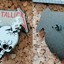 Second picture of Damage Inc. Enamel Pin