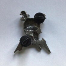 Back of Damage Inc. Pewter Pin