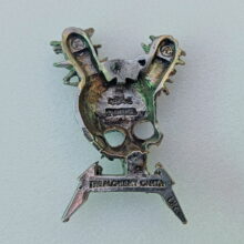 Back of Damage Inc. Pewter Pin