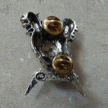 Back of Damage Inc. Pewter Pin