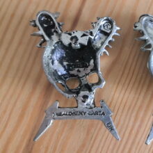 Back of Damage Inc. Pewter Pin With Black Logo Back of Damage Inc. Pewter Pin With Black Logo