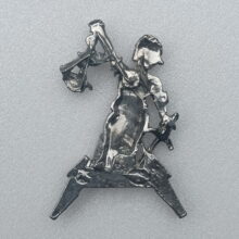 Back of Justice Pewter Pin With Black Logo