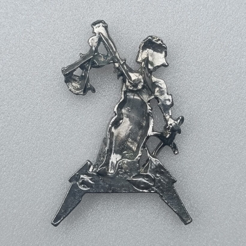 Back of Justice Pewter Pin With Black Logo