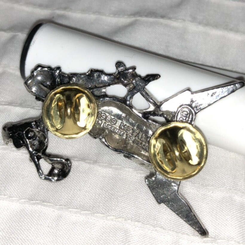 Back of Justice Pewter Pin With Red Logo