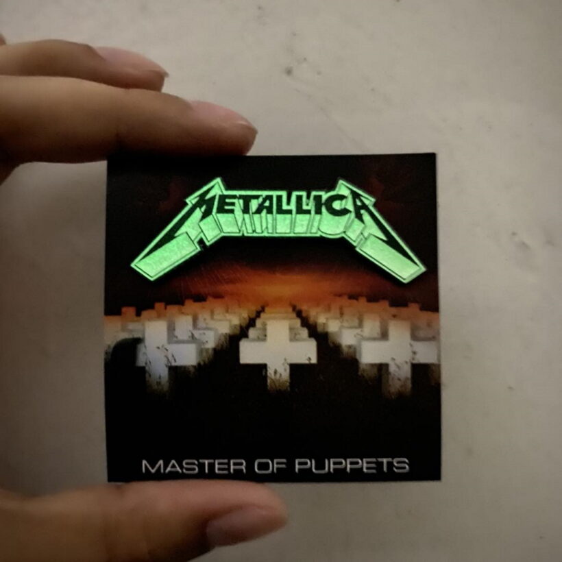 Glowing effect of Metallica Master of Puppets Logo Enamel Pin