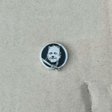 lars-drumhead-drumsticks-enamel-pin-1-2