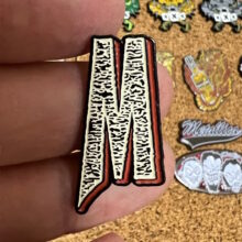m-logo-enamel-pin-10-1